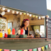 Woman in a food truck looking at the camera - emotional intelligence in business